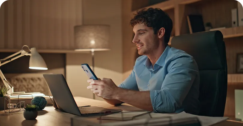 Person working on laptop reviewing property income