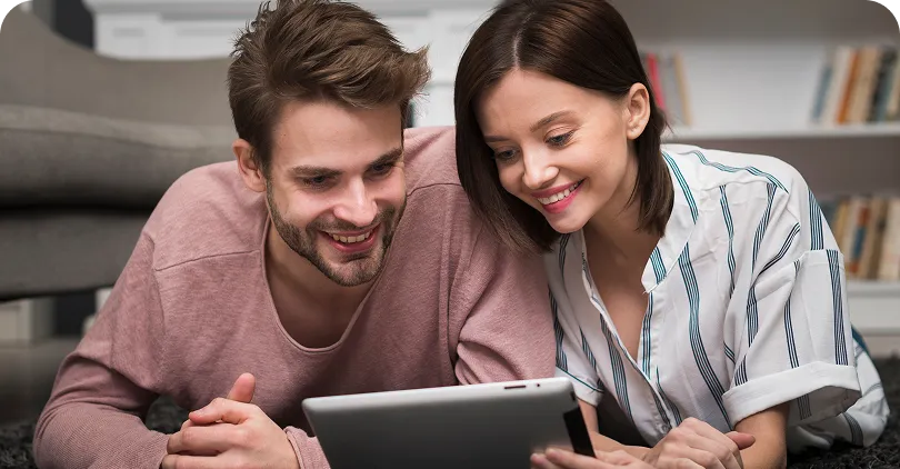 Couple reviewing property metrics on a tablet